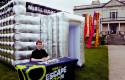 Mobile Escape Rooms inflatable tent with festival flags and staff member